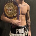 Paolo Magui holds the BBU title belt after a hard-fought 10-round battle against David Rajuili.